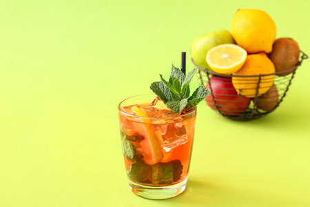 Glass of tasty ice tea with lemon on color backgroundの写真素材