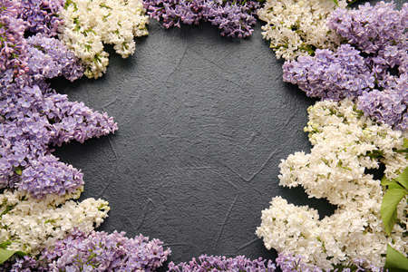Frame made of beautiful lilac flowers on dark backgroundの写真素材
