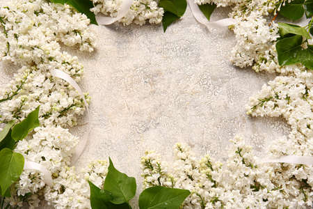 Frame made of beautiful lilac flowers on light backgroundの写真素材