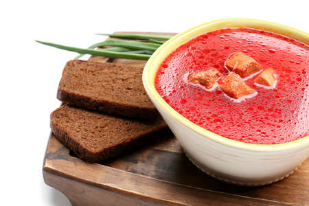 Bowl with tasty borscht and bread on white background, closeupの写真素材