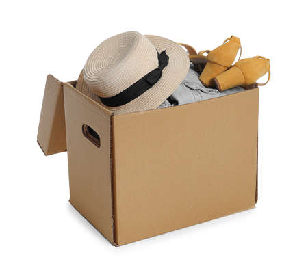 Wardrobe box with hat, clothes and shoes on white background