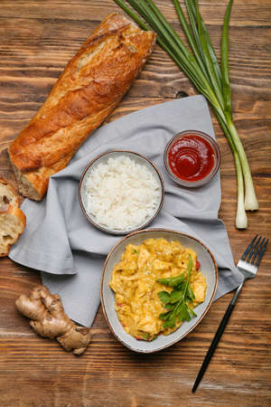 Composition with tasty chicken curry on wooden backgroundの写真素材