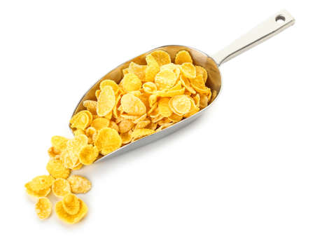 Scoop with delicious cornflakes on white background