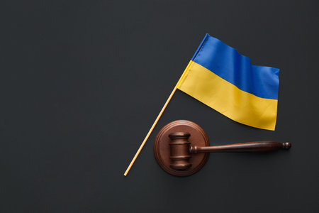 Judge's gavel and flag of Ukraine on black backgroundの写真素材