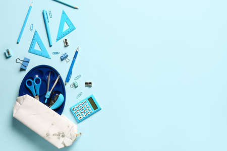 Pencil case and stationery on color backgroundの写真素材