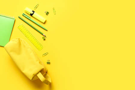 Pencil case and stationery on color backgroundの写真素材