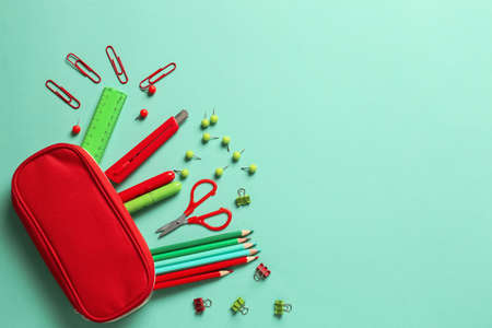 Pencil case and stationery on color backgroundの写真素材