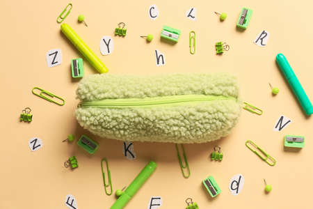 Pencil case and stationery on color backgroundの写真素材