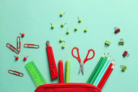 Pencil case and stationery on color backgroundの写真素材