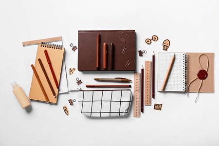 Pencil case with stationery on white background