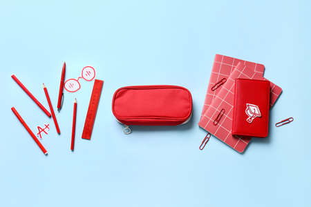 Pencil case with stationery on color backgroundの写真素材