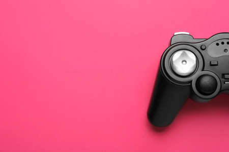 Modern joystick on color background, closeup