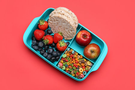 Lunchbox with tasty food on color backgroundの写真素材
