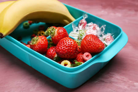 Lunchbox with tasty food on color backgroundの写真素材