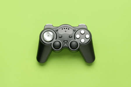 Modern joystick on green backgroundの写真素材