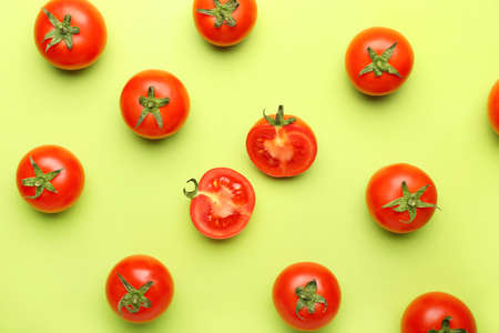 Fresh ripe tomatoes on color backgroundの写真素材