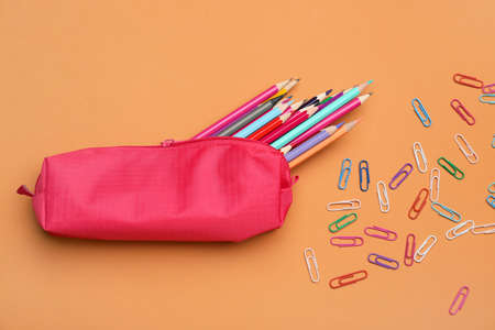 Pencil case and stationery on color backgroundの写真素材