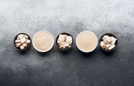 Bowls with different yeast on black and white backgroundの写真素材
