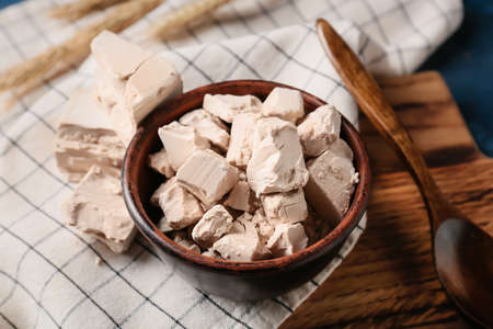 Bowl with fresh yeast on tableの写真素材