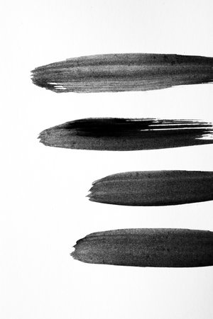 Ink strokes on white paperの写真素材
