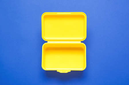 Plastic lunch box on color backgroundの写真素材