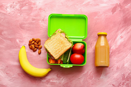 Lunch box with tasty food on color backgroundの写真素材