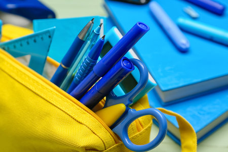 Pencil case and stationery on wooden backgroundの写真素材