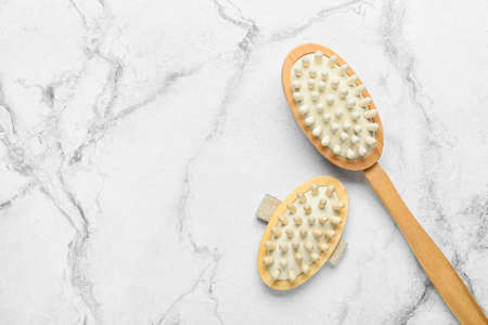 Massage brushes on light backgroundの写真素材