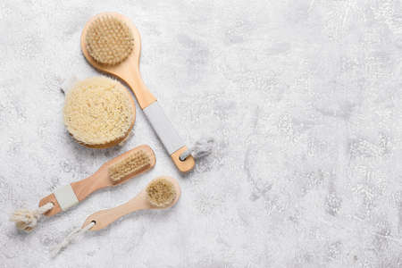 Different massage brushes on light backgroundの写真素材