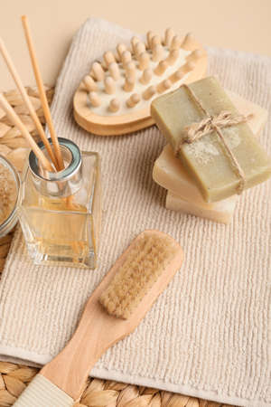 Different massage brushes and bath supplies on color backgroundの写真素材