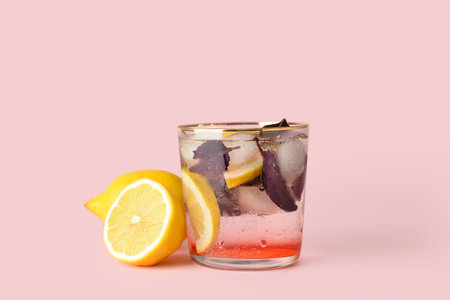 Glass of tasty lemonade with basil on color backgroundの写真素材