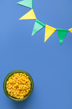 Corn and garland on color background. Festa Junina (June Festival) celebrationの写真素材