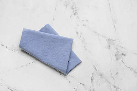 Clean napkin on light background, top view
