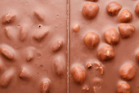 Tasty chocolate with nuts as backgroundの写真素材