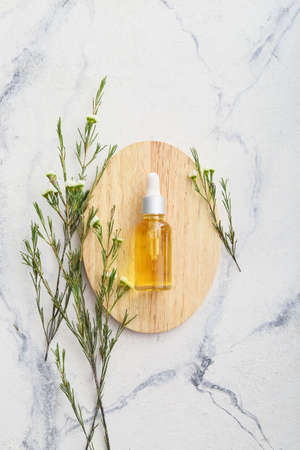 Bottle of natural essential oil on white backgroundの写真素材