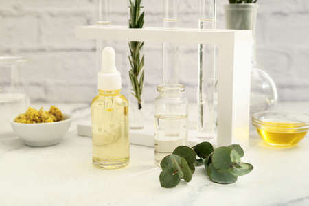 Bottles of natural essential oils in laboratory