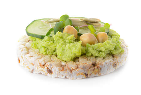 Crispbread with tasty hummus on white backgroundの写真素材