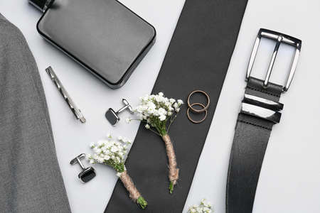 Set of groom's wedding accessories on light backgroundの写真素材