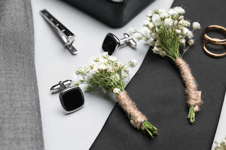 Set of groom's wedding accessories on light backgroundの写真素材