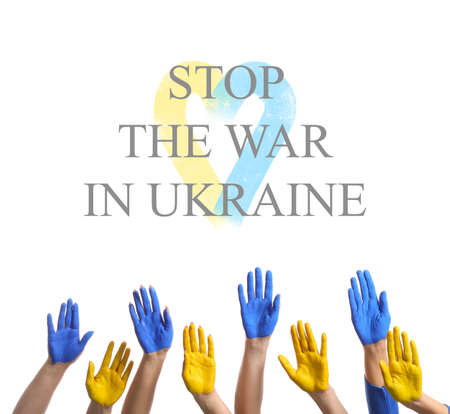 Hands painted in colors of Ukrainian flag on white background. STOP THE WAR IN UKRAINEの写真素材