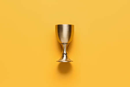 Sacramental goblet for wine on color background. Rosh hashanah (Jewish New Year) celebrationの写真素材