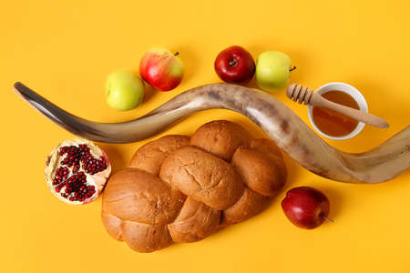 Symbols of Rosh hashanah (Jewish New Year) on color backgroundの写真素材