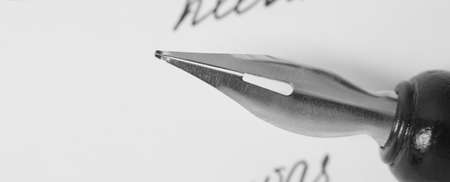 Nib pen on letter, closeup viewの写真素材