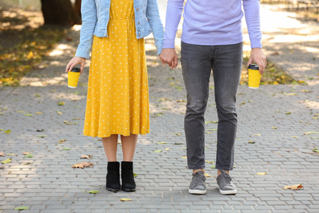 Happy young couple on romantic date in parkの写真素材