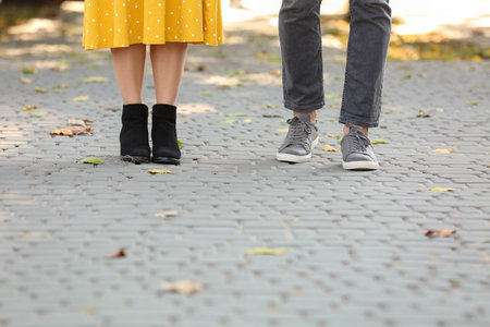 Happy young couple on romantic date in parkの写真素材