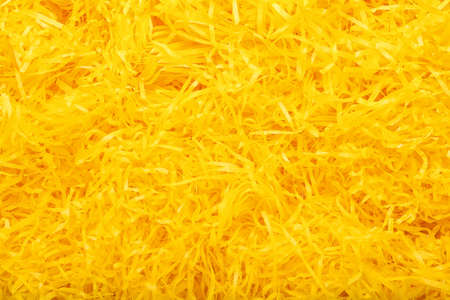 Heap of yellow shredded paper as background