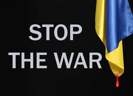 Flag of Ukraine with dripping blood and text STOP THE WAR on black backgroundの写真素材
