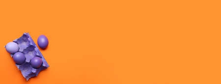 Holder with painted Easter eggs on orange background with space for text