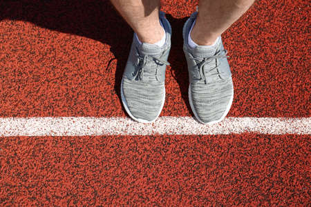 Man on start line in stadium
