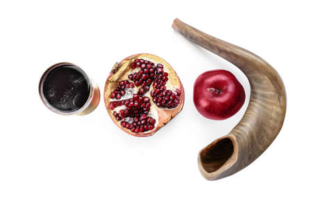 Shofar with sacramental goblet of wine and fruits on white background. Rosh hashanah (Jewish New Year) celebrationの写真素材
